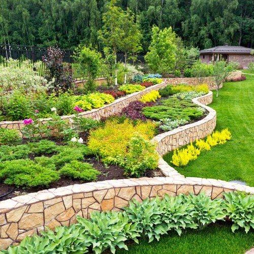 Terraced planting beds with stone retaining walls